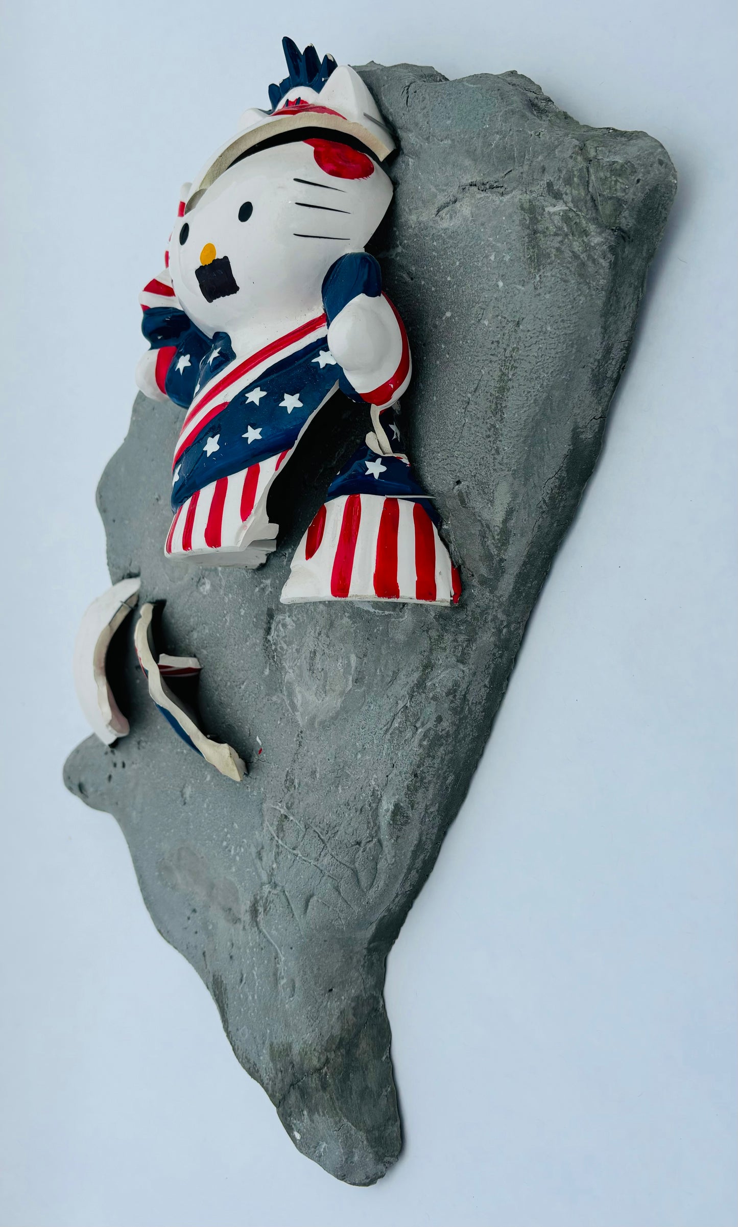 “Kitty Corrupted”: Mustachioed Hello Kitty White on USA Wall Sculpture