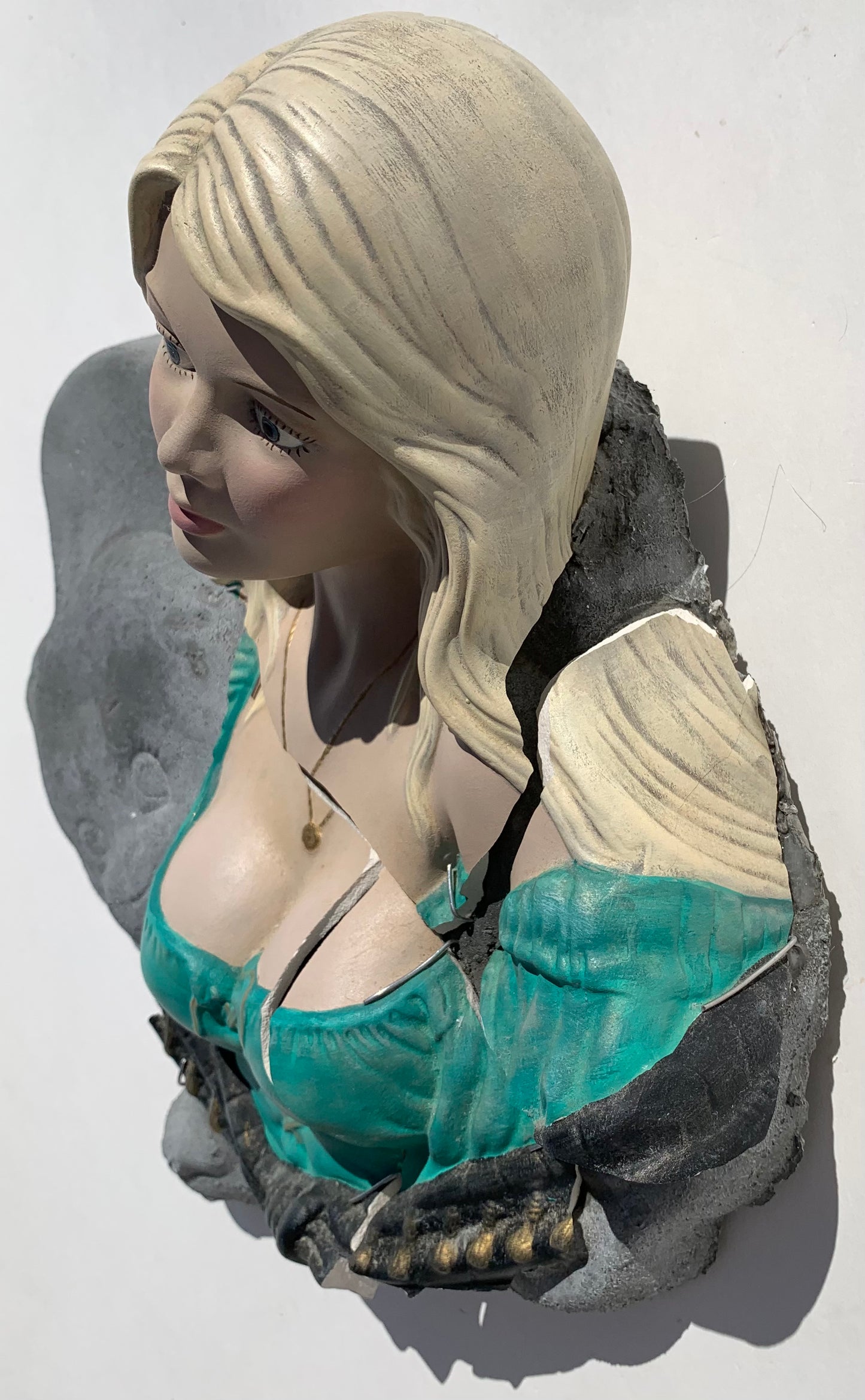 "Bad News": Blonde Woman on Crawling Baby Wall Sculpture
