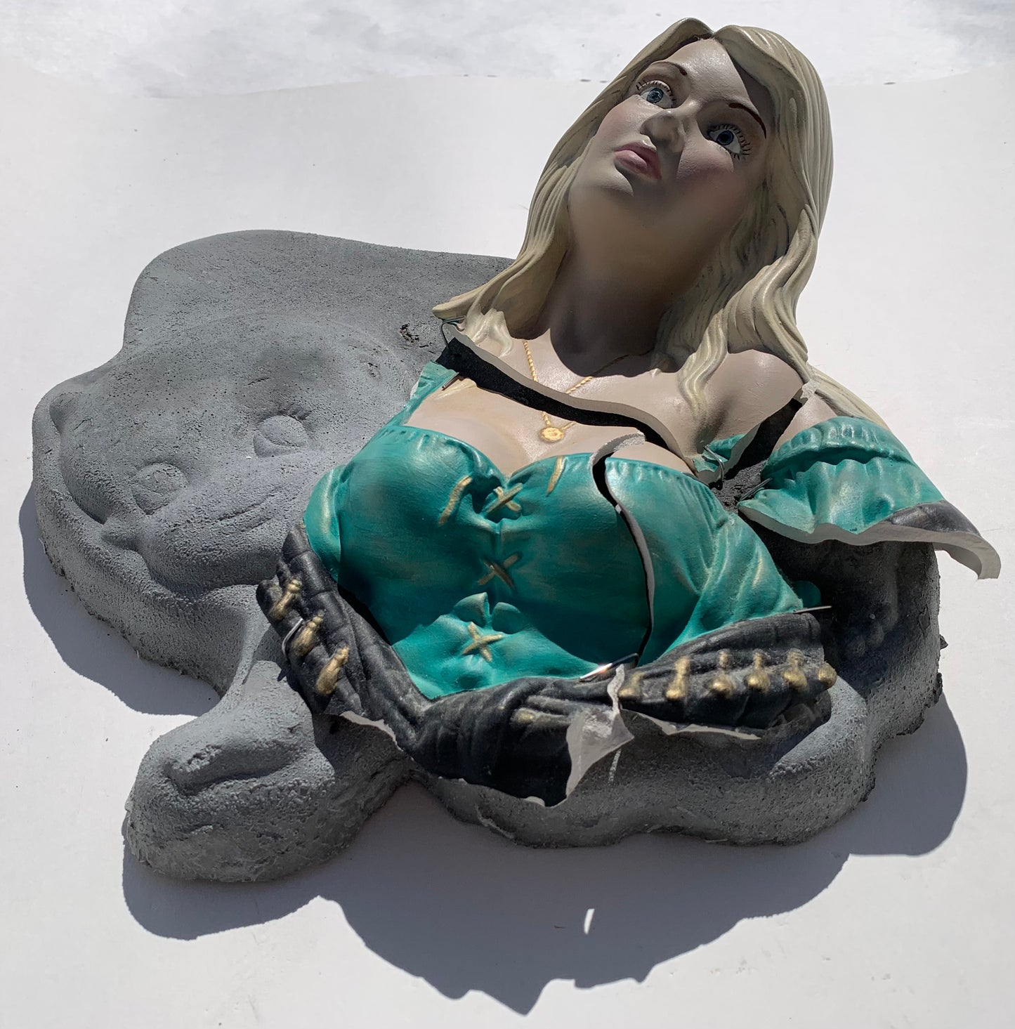 "Bad News": Blonde Woman on Crawling Baby Wall Sculpture