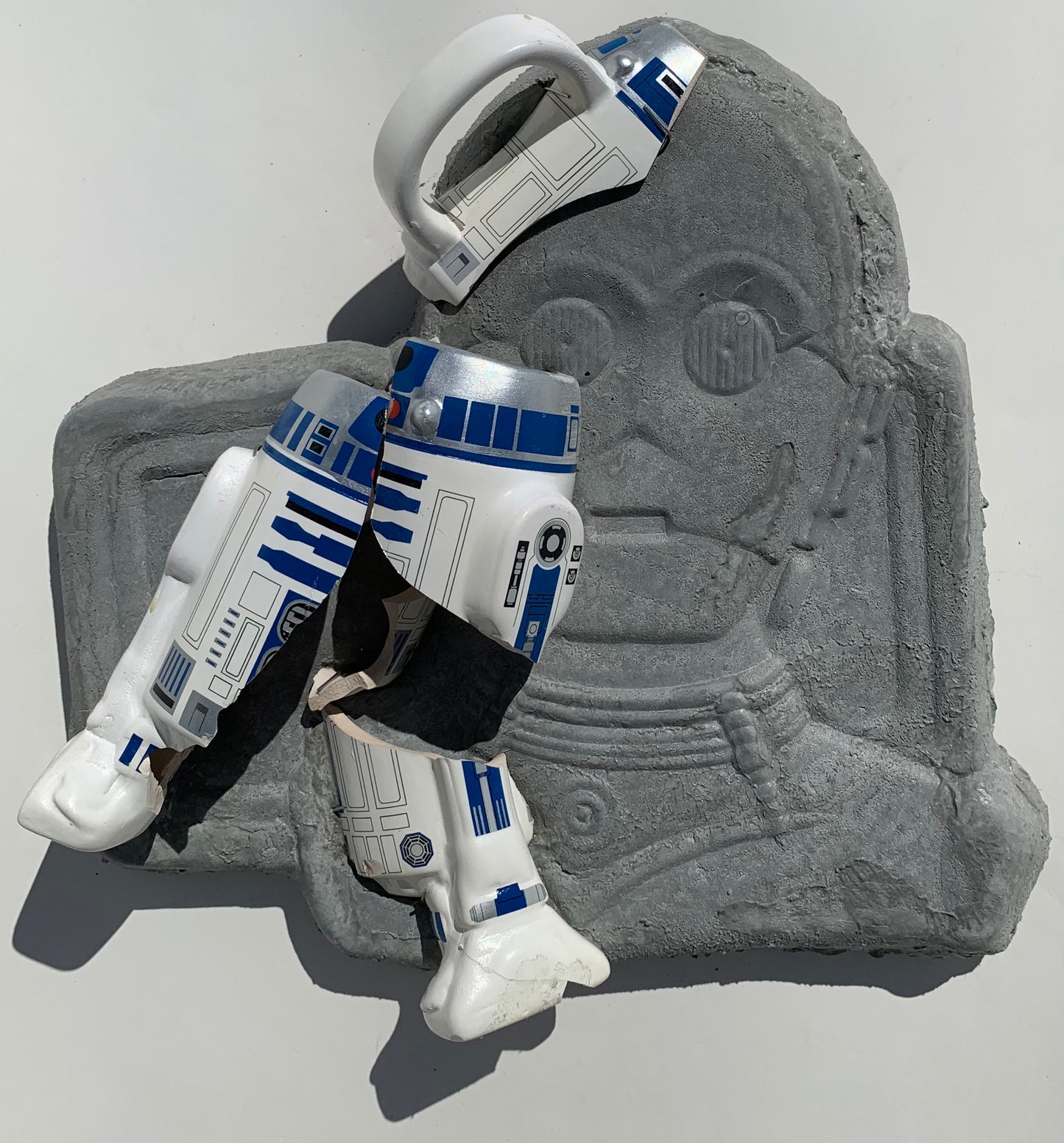 "Cosmic Relief": R2D2 on C3PO Wall Sculpture