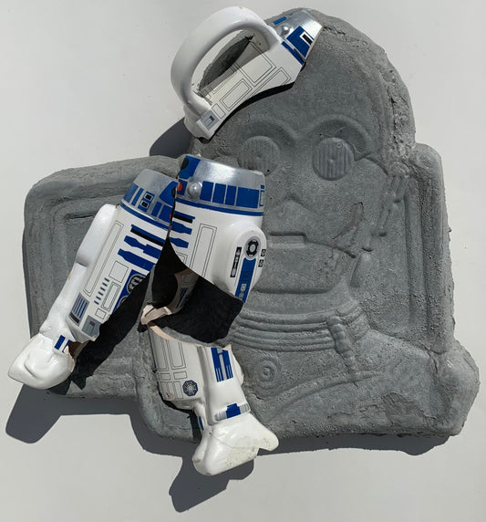 "Cosmic Relief": R2D2 on C3PO Wall Sculpture