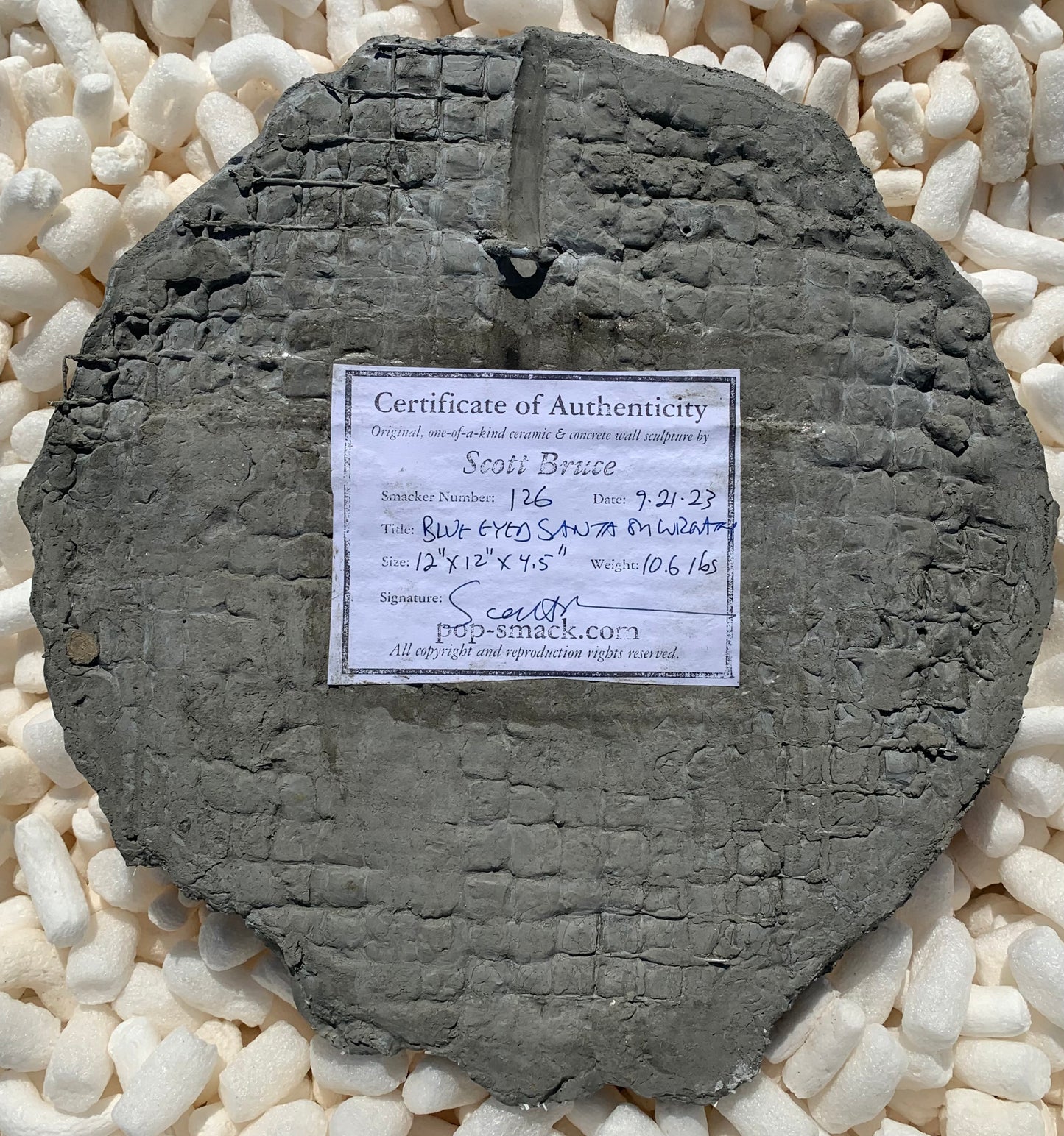 "Toys or Trash?" Toy Sack Santa on Wreath Wall Sculpture