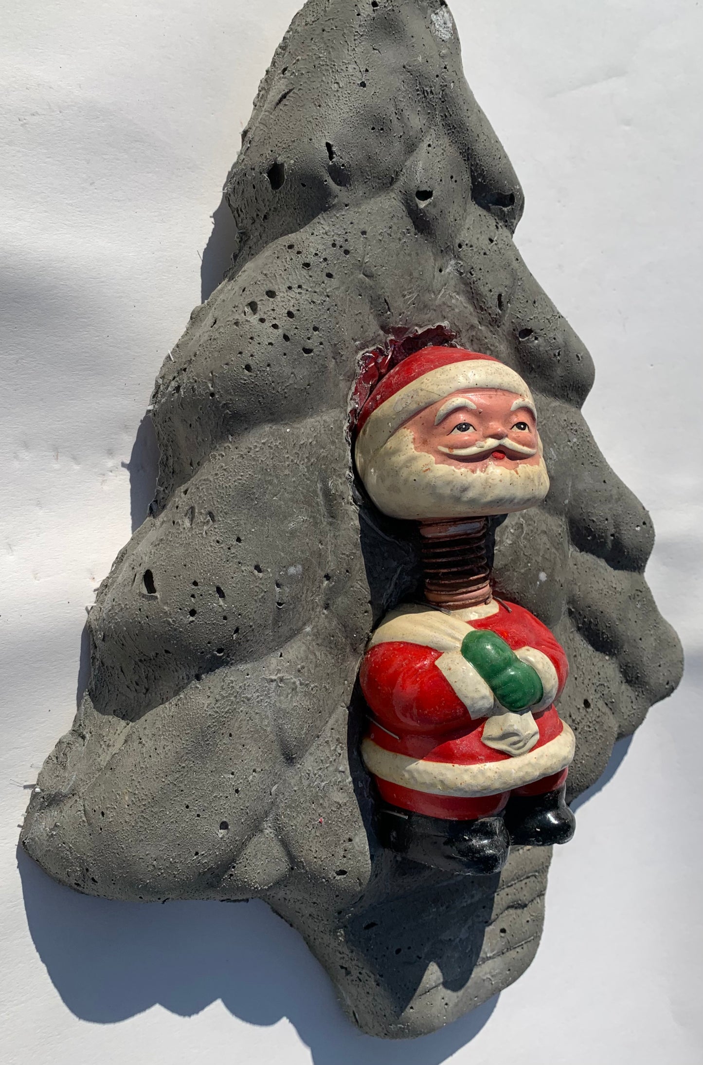 "Spring-Loaded Santa": Bobble Head Santa on Evergreen Tree Wall Sculpture