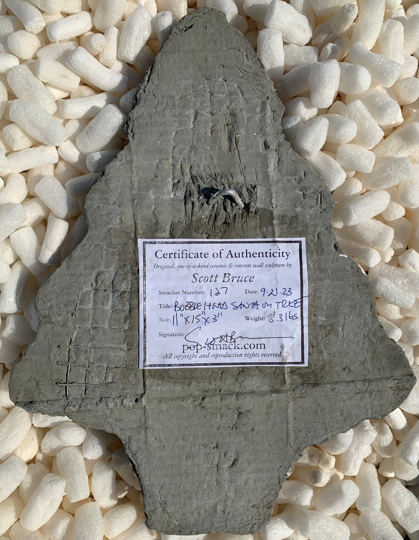 "Spring-Loaded Santa": Bobble Head Santa on Evergreen Tree Wall Sculpture