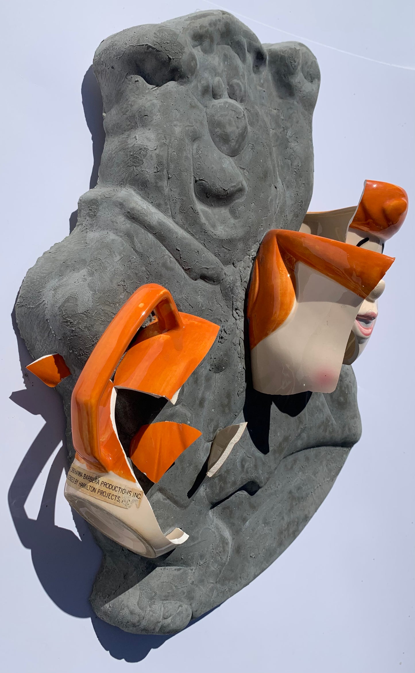 "Rock Solid Marriage": Wilma on Fred Flintstone Wall Sculpture