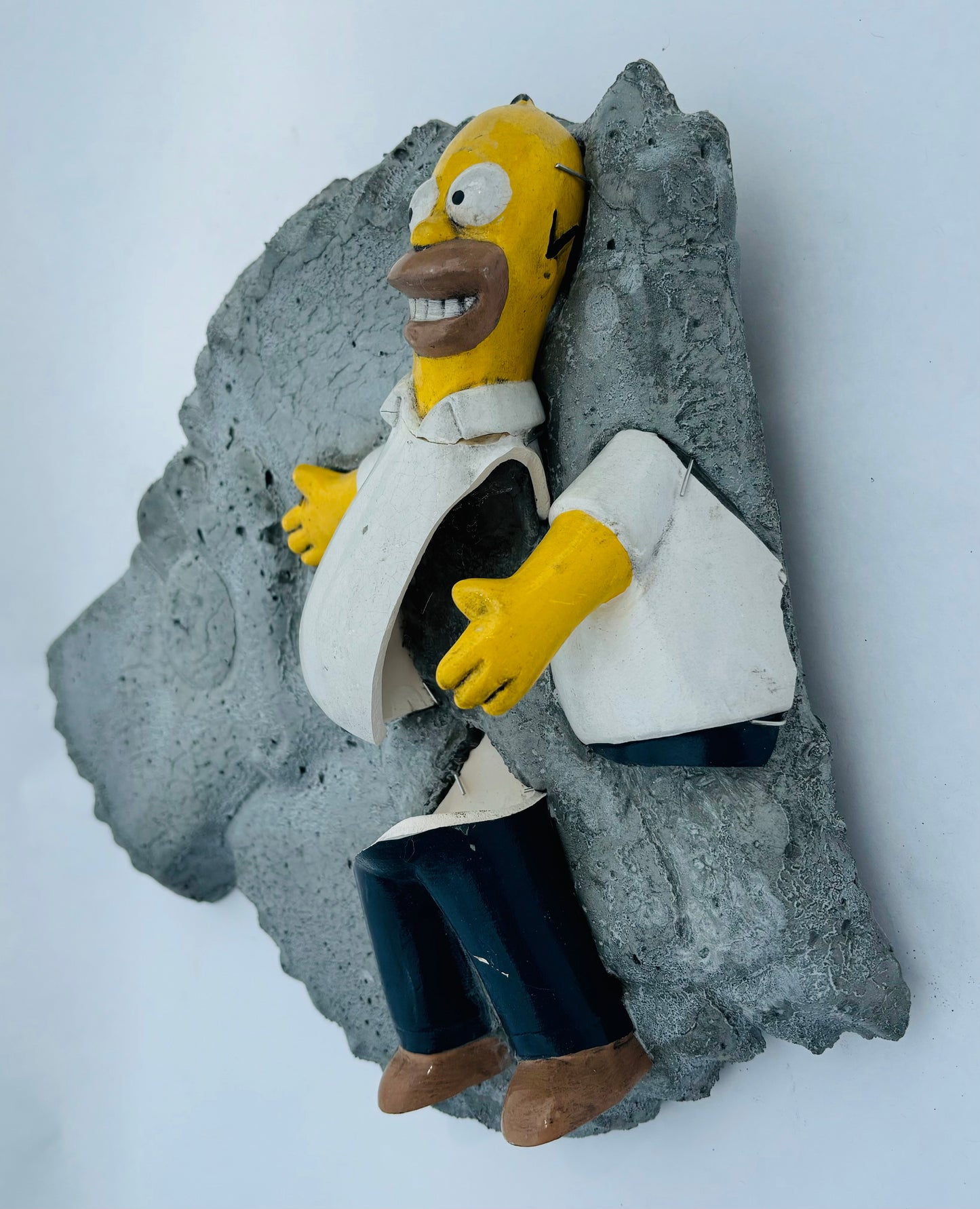 “MAGA Material”: Homer Simpson on Bart Simpson Wall Sculpture