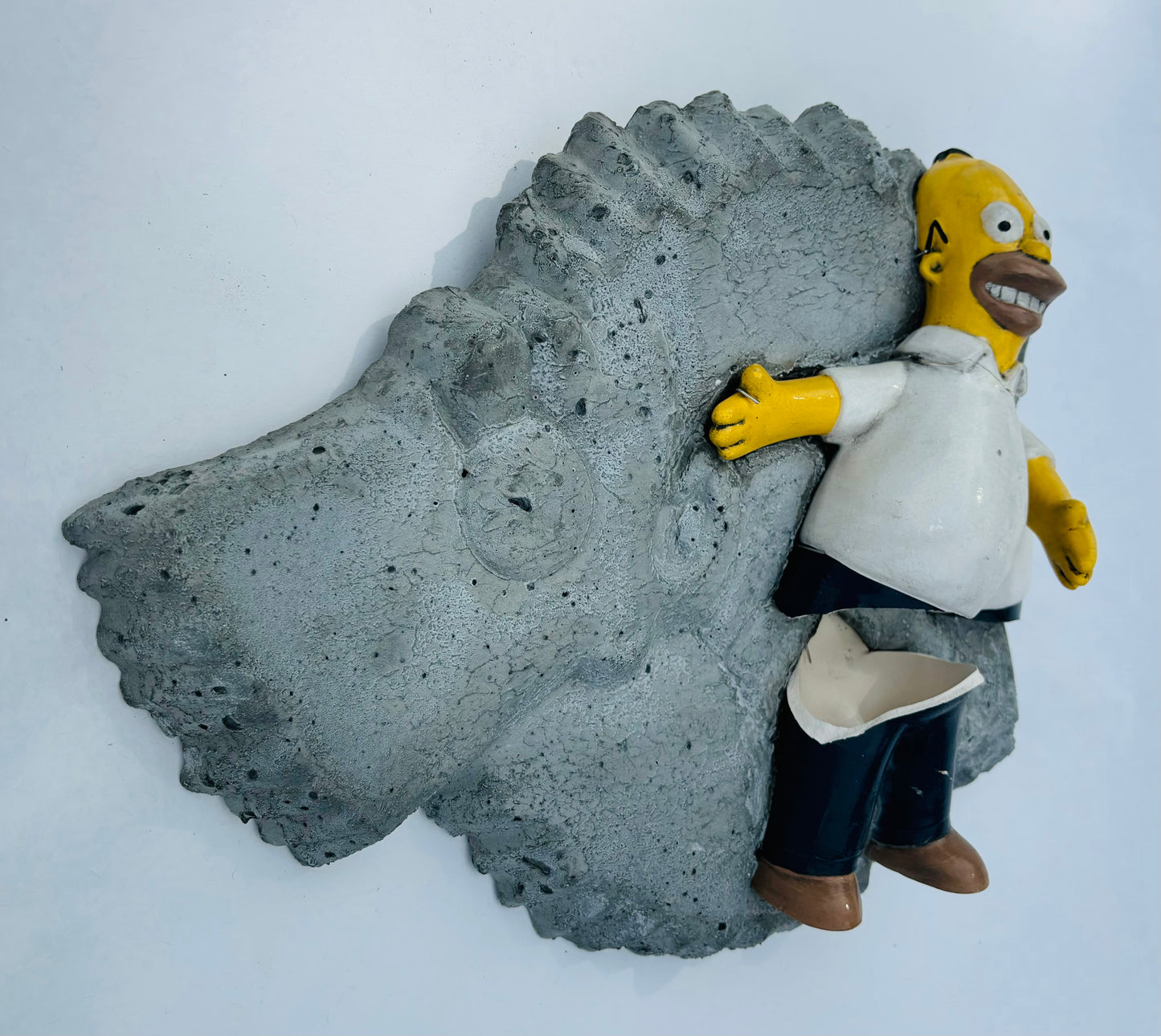 “MAGA Material”: Homer Simpson on Bart Simpson Wall Sculpture