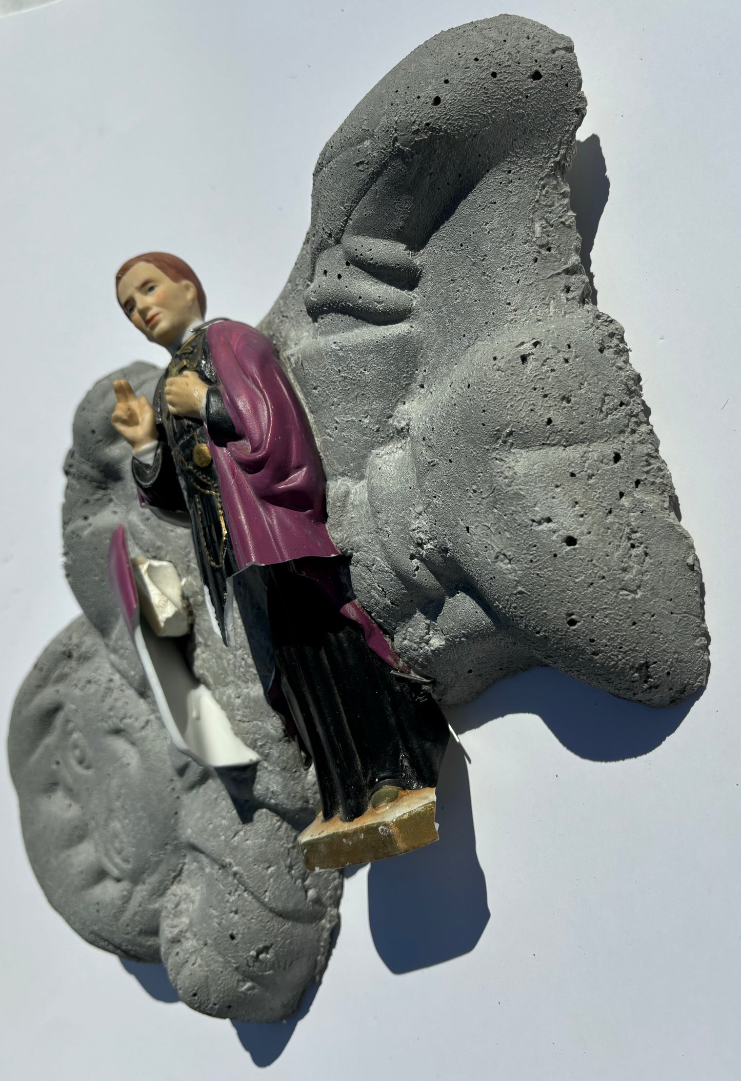 "Ordained Evil": Catholic Priest on Boy Wall Sculpture